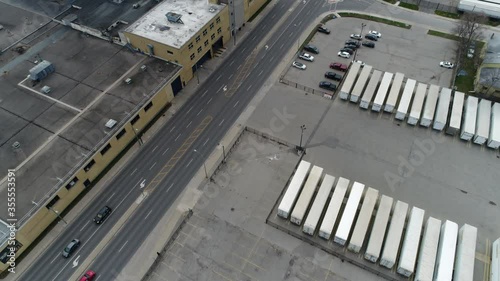 Aerial Over Trucking Shipping Yard in Industrial Area With Very Little Traffic During Day photo