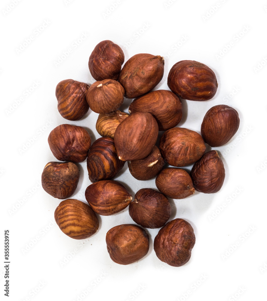 Fototapeta premium Portion of hazelnuts on a white background
