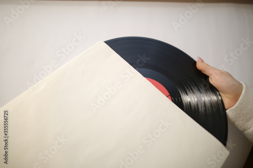 vinyl record. Black vinyl record in the package. Top view photo