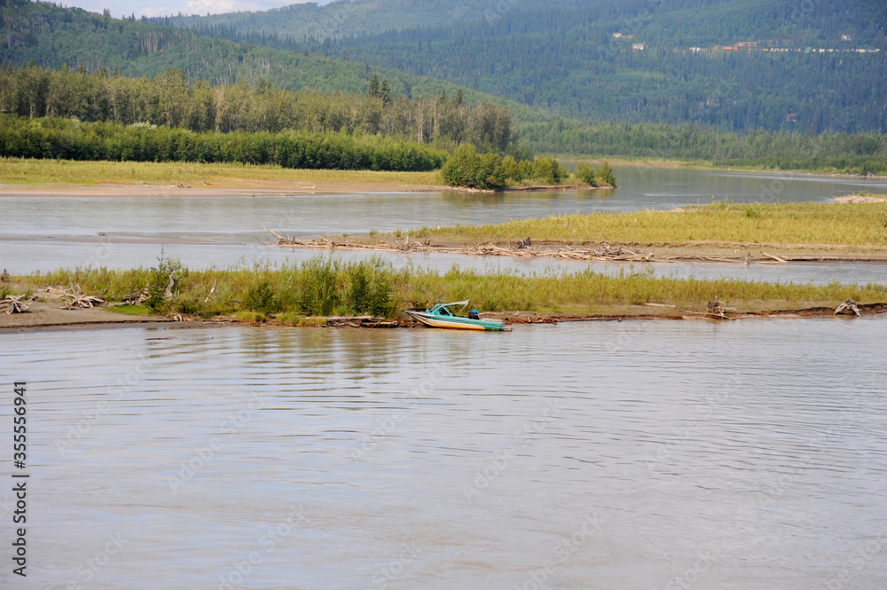 Speedboat parked on an island in the middle of Chena River in Fairbanks, Alaska. Speedboat parked on an island in the middle of Chena River in Fairbanks, Alaska.