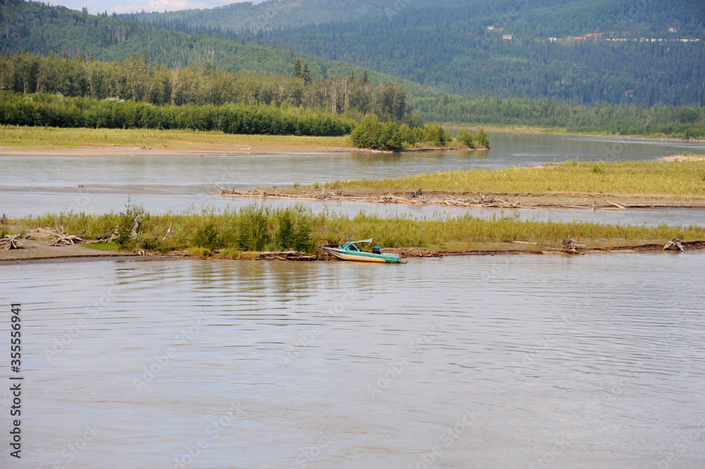 Speedboat parked on an island in the middle of Chena River in Fairbanks, Alaska.