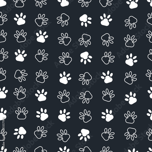 Seamless vector illustration. Modern art of dog’s paws. grey background.