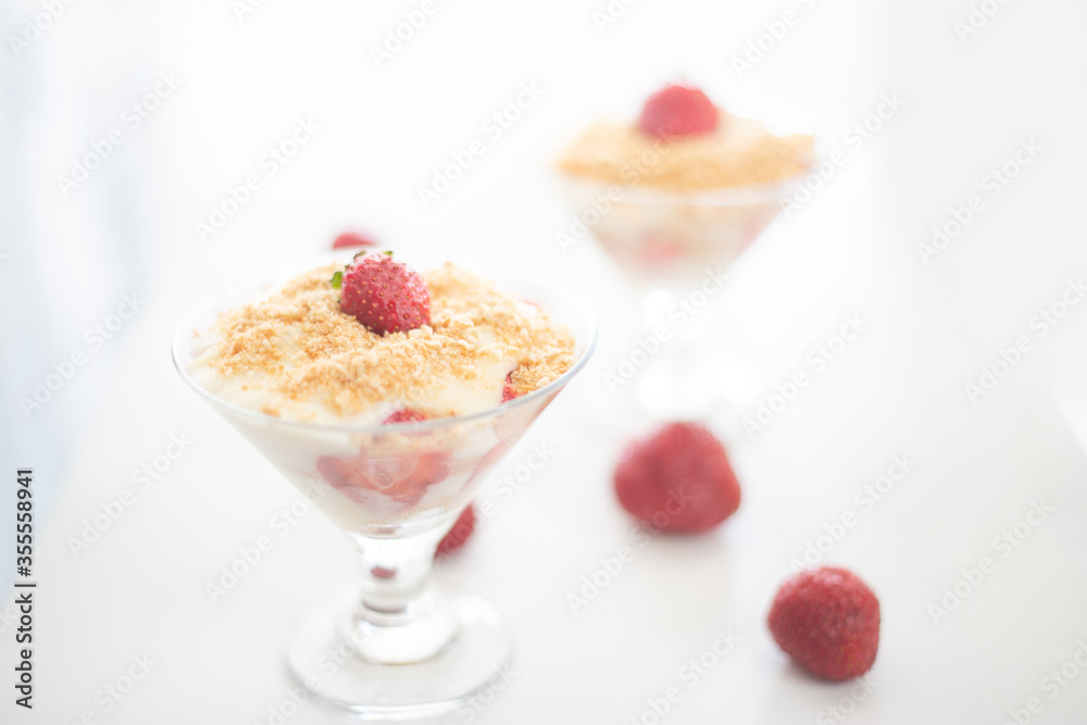 Strawberry magnolia pudding close up view with copy space in minimal white studio looking Strawberry magnolia pudding close up view with copy space in minimal white studio looking