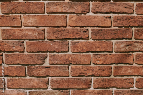 part of an old brick brown wall as background. High quality photo