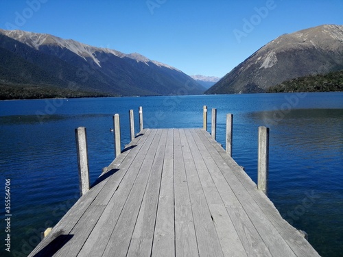 Lonely jetty in New Zealand. Lake Rotoiti Lakes National Park.