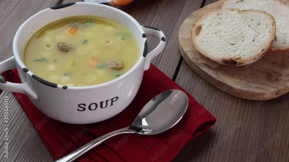 A bowl of delicious brazilian soup with beef, vegetables and noodles A bowl of delicious brazilian soup with beef, vegetables and noodles