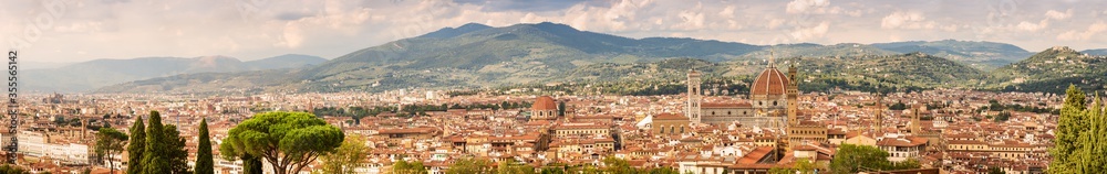 Beautiful panoramic view of the city of Florence. Cathedral of Santa Maria del Fiore (Duomo), mountains and roofs of houses Florence, Italy