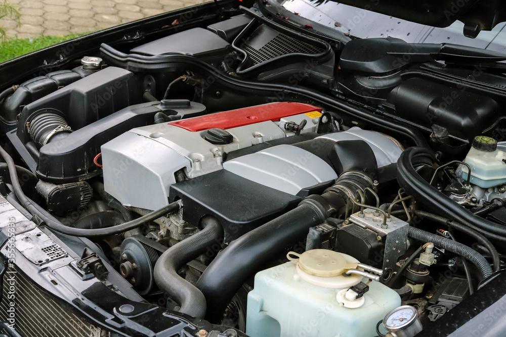 Fototapeta premium Powerful car engine with open hood