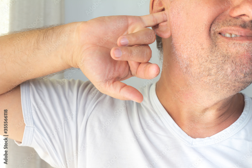 Caucasian middle-aged man. Latino man with finger in ear. Caucasian middle-aged man. Latino man with finger in ear.