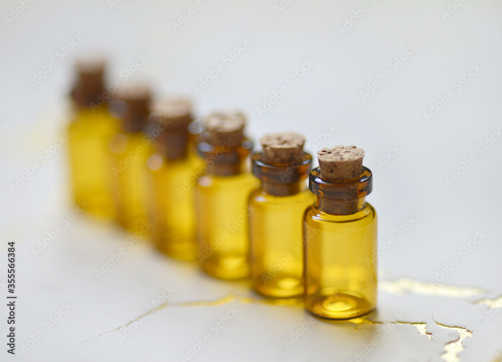 Small chemical glass bottles on white background. Small chemical glass bottles on white background.