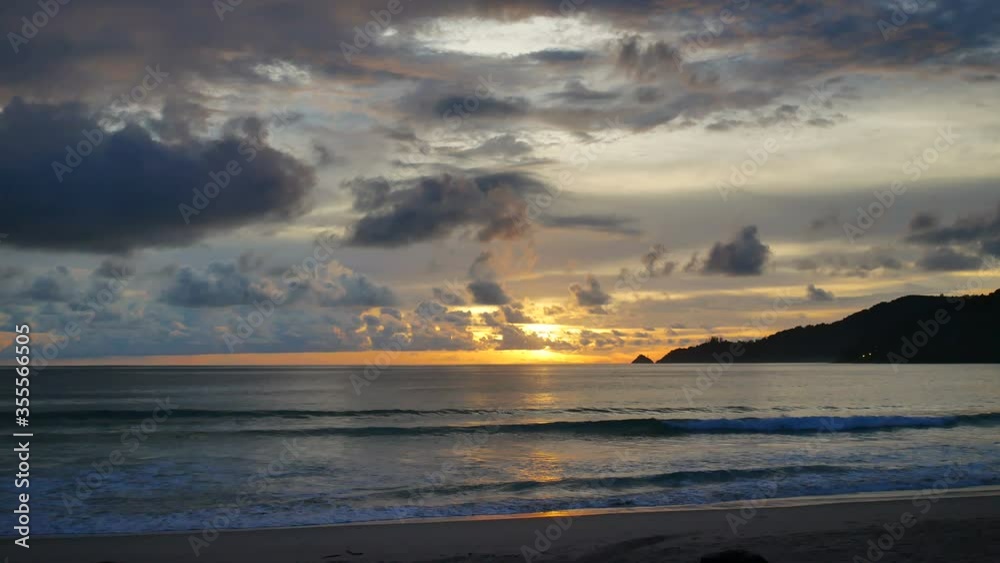 water sea wave hit sand beach , mountain long distance with cloudy sky background at evening time water sea wave hit sand beach , mountain long distance with cloudy sky background at evening time
