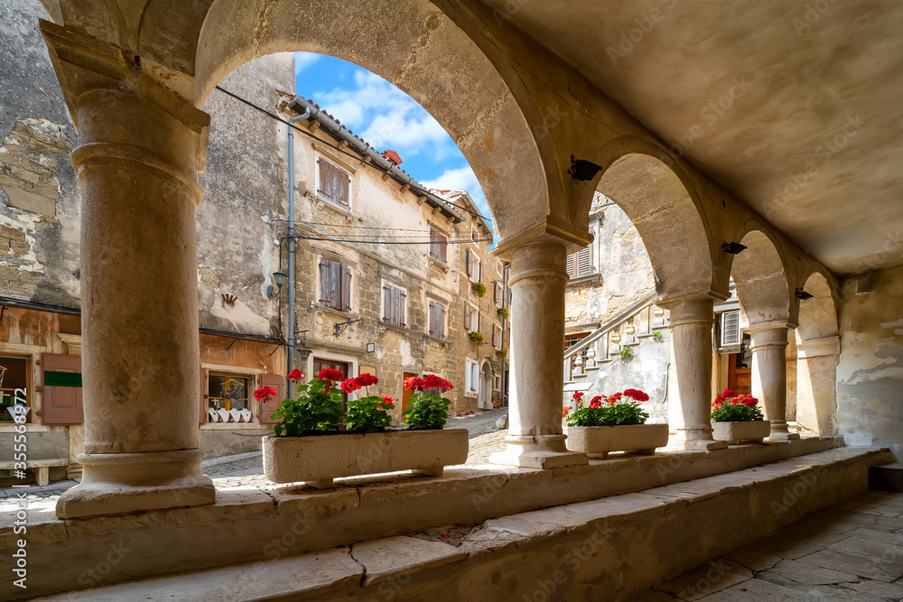 Beautiful arcs on old authentic Istrian building in Groznjan, Croatia.