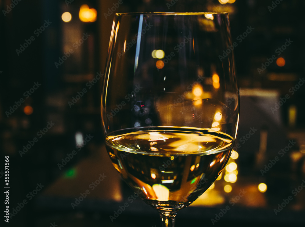 White Wine in the Glass in a Dark Room