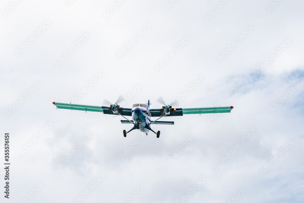 Fototapeta premium A twin otter DHC-6-300 aircraft prepares to land 