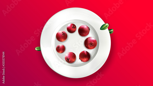 Still life of lingonberries arranged in a circle on a white plate.