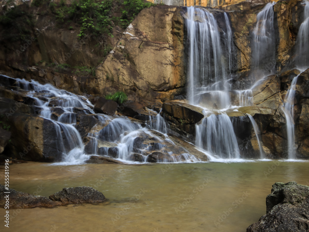 Waterfall found in tropical rainforest in malaysia Waterfall found in tropical rainforest in malaysia