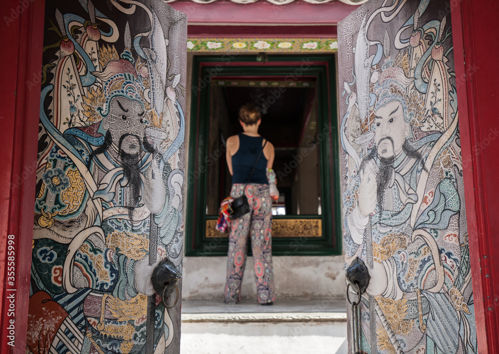 Tourist visit buddhist temple in thailand