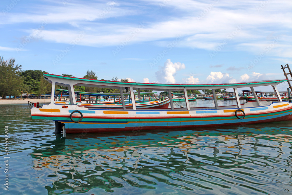 Colorful boats and sandy beaches in Belitung, Indonesia.