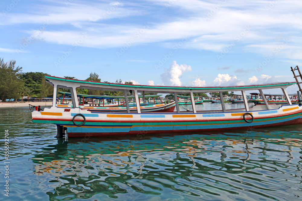 Obraz premium Colorful boats and sandy beaches in Belitung, Indonesia.