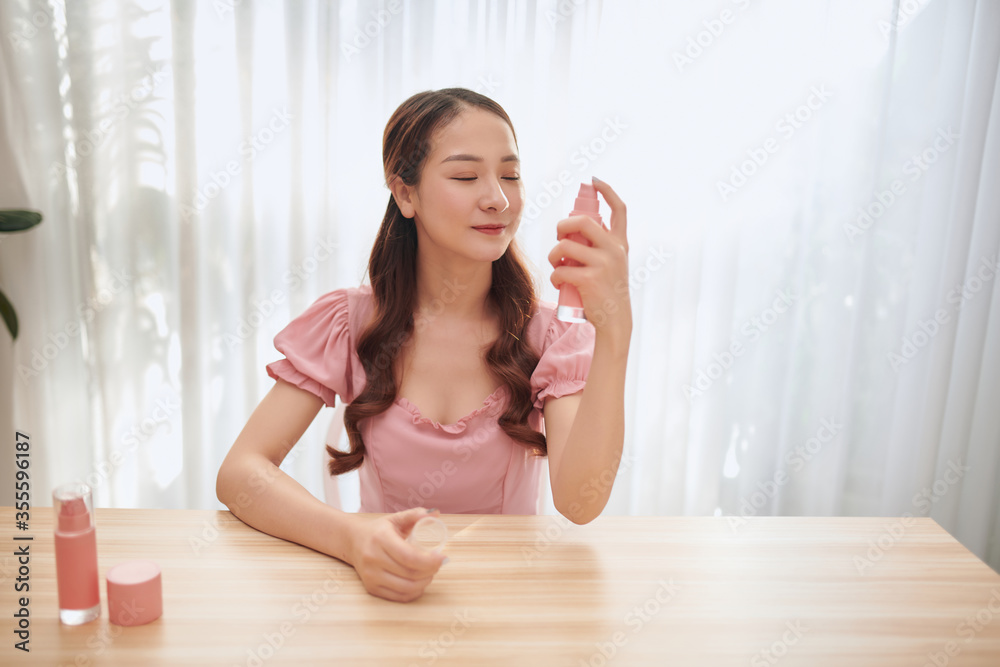 Girl with perfume, young beautiful woman holding bottle of perfume and smelling aroma. Girl with perfume, young beautiful woman holding bottle of perfume and smelling aroma.