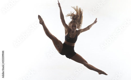 female sporty ballet dancer in front of white background
