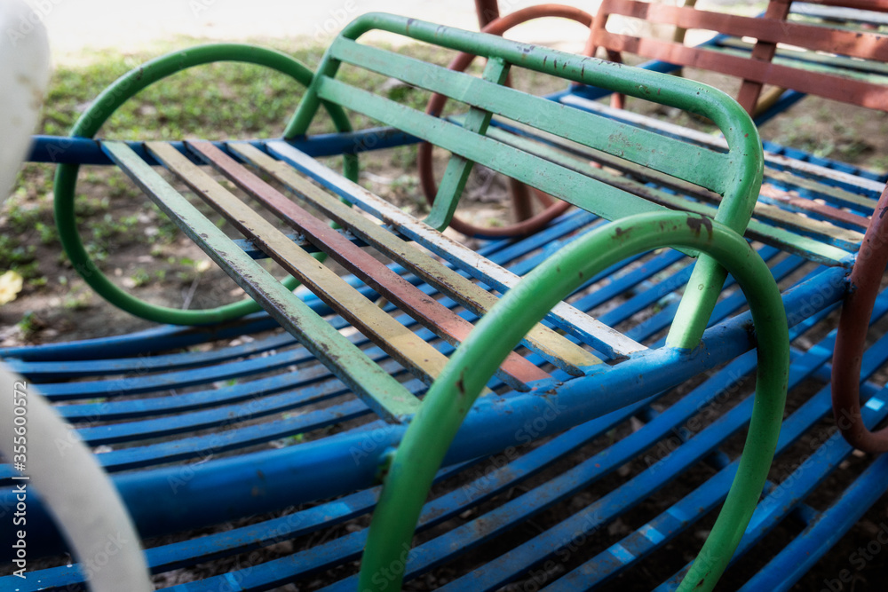 Blue chairs of playground in the park 