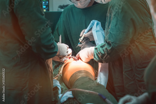 Φωτογραφία hip replacement surgery in progress, open cavity with scalpel and soft-tissue retractors