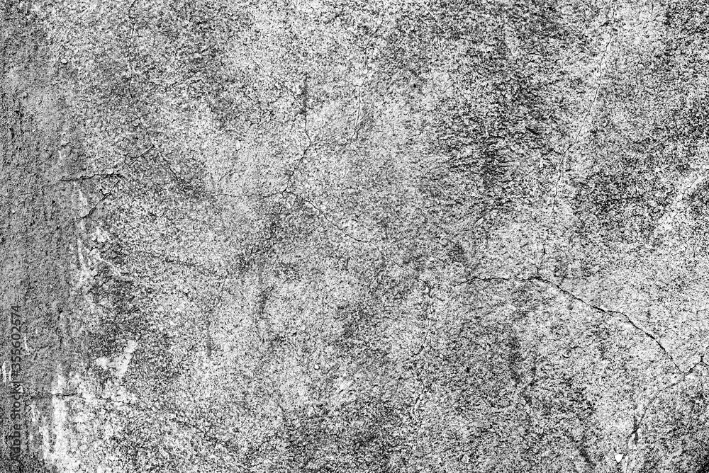 Texture of a concrete wall with cracks and scratches which can be used as a background Texture of a concrete wall with cracks and scratches which can be used as a background