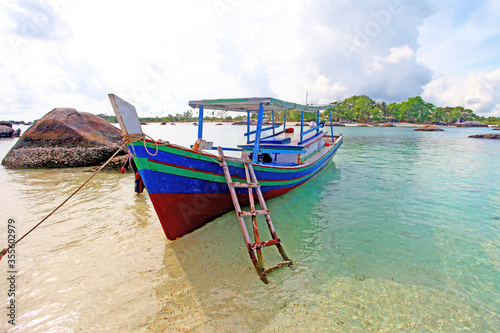 Colorful boats and sandy beaches in Belitung, Indonesia © LilyRosePhotos