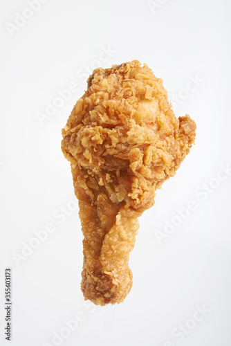 vertical fried chicken drumsticks isolated on white background photo