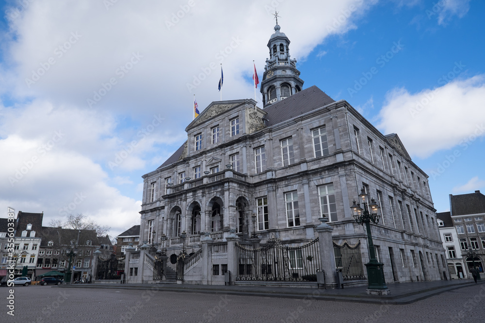 The Maastricht city hall  on the Markt in the center of Maastricht with blue sky and clouds