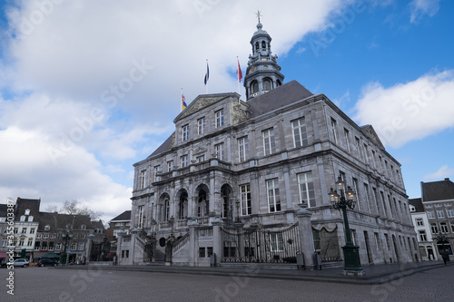 The Maastricht city hall  on the Markt in the center of Maastricht with blue sky and clouds