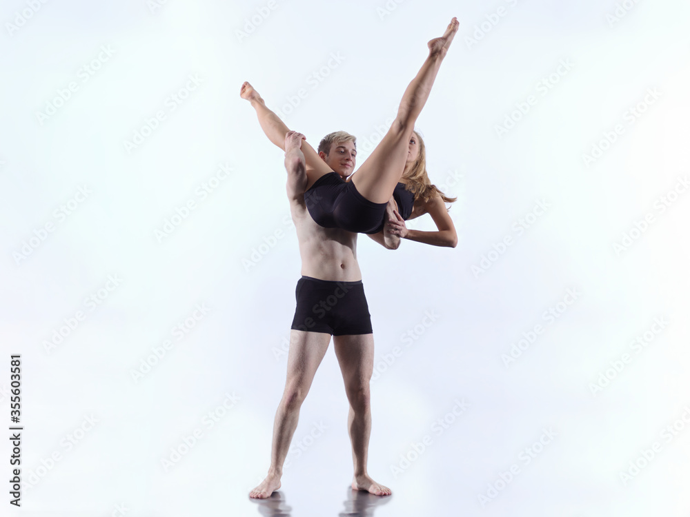 couple of athletic dance partners in front of white background couple of athletic dance partners in front of white background