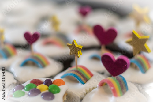 Isolated close up of multiple delicious decorated cupcakes with whip cream and candy in a birthday party- Israel