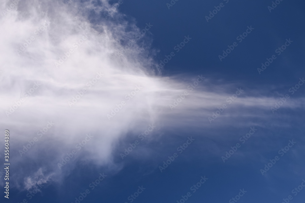 White light clouds in the blue sky background
