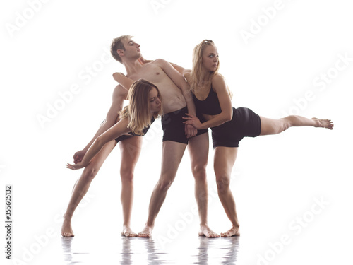 group of athletic dance partners in front of white background