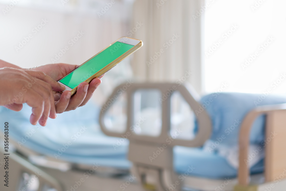 Green Screen Mock up smartphone for Text advertising with another patient on hospital bed for Telemedicine Care advice, Health care technology in Hospital Patients woman senior using smart phone Green Screen Mock up smartphone for Text advertising with another patient on hospital bed for Telemedicine Care advice, Health care technology in Hospital Patients woman senior using smart phone