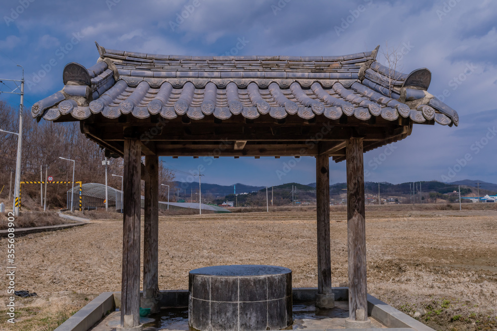 Covered water well in park Covered water well in park