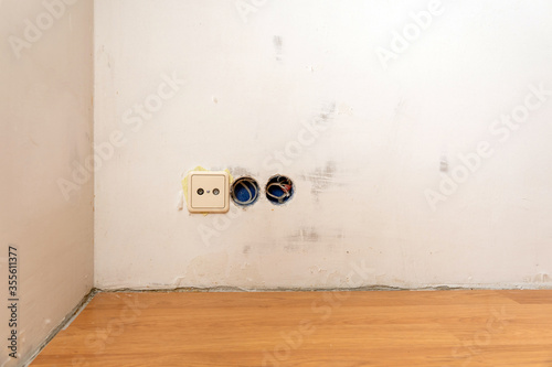 Row of electric outlet set in bedroom wall, TV outlet , cable outlet and Electronic plug with Asia style on grey fabric texture wallpaper, cable television. Electricity concept. photo