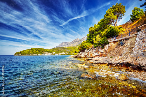 The Amazing sunset at rocky stone beach at Drvenik in Croatia. Adriatic sea, Croatia, Europe. Beautiful world of Mediterranean countries.