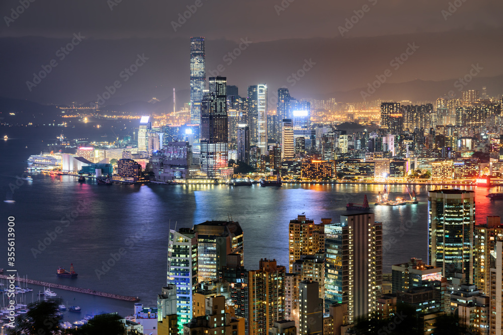 Naklejka premium Awesome night aerial view of Victoria Harbor and Hong Kong