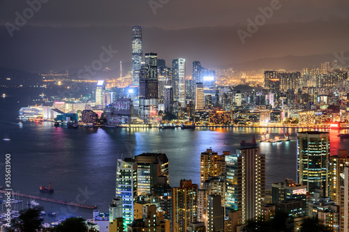 Awesome night aerial view of Victoria Harbor and Hong Kong