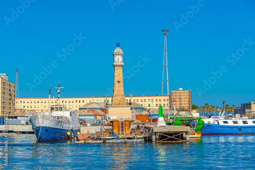Photography View of the port of Barcelona with Torre del Rellotge tower, Spain