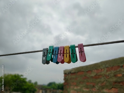 Photography Close up of some cloth hanging clips Stock Photo