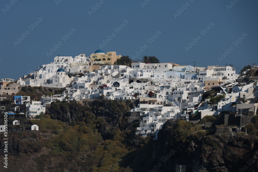 Aerial panorama of white villas in Imerovigli, Santorini island, Greece