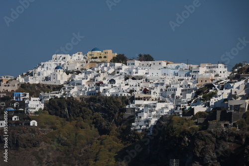 Aerial panorama of white villas in Imerovigli, Santorini island, Greece