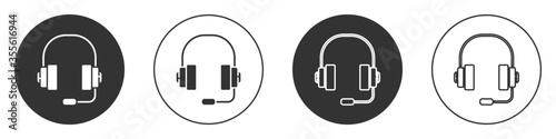 Black Headphones icon isolated on white background. Support customer service, hotline, call center, faq, maintenance. Circle button. Vector Illustration.