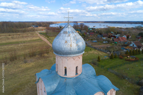 Cross and dome of the medieval Church of the Savior on Nereditsa close-up on April day (shot from a quadrocopter). Surroundings of Veliky Novgorod, Russia photo