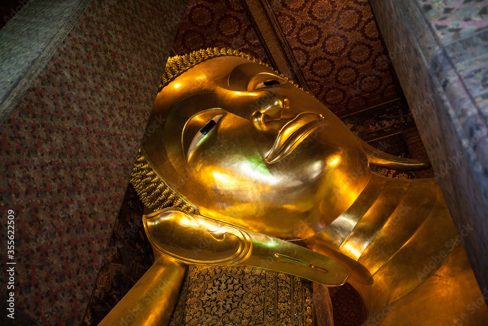 Golden reclining buddha statue in wat pho, Bangkok, Thailand