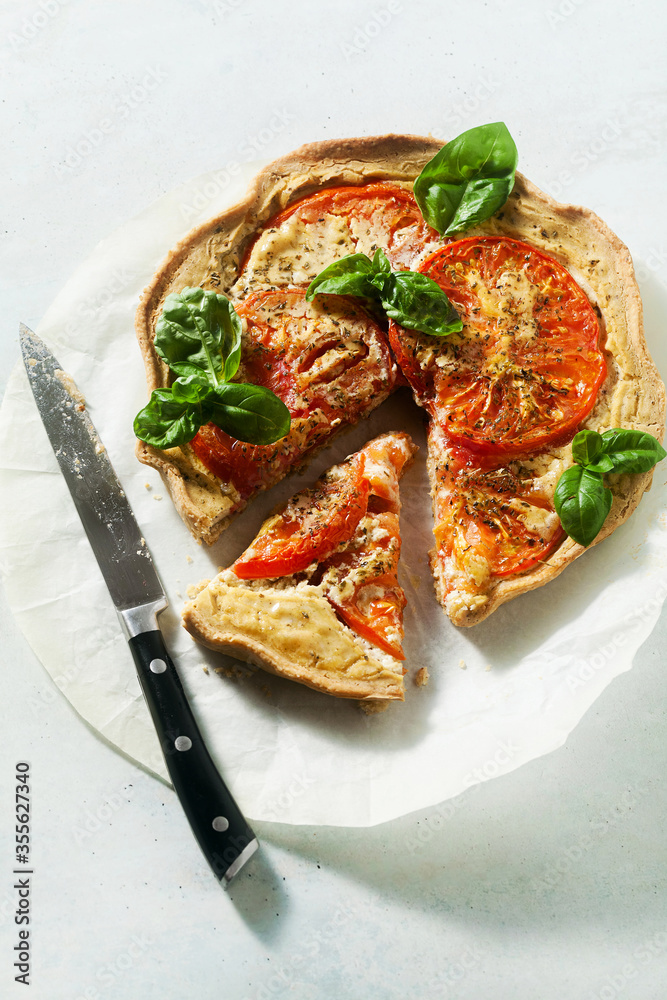 summer vegan pie galette with tomatoes and tofu in oat milk. tasty snack or healthy food lunch